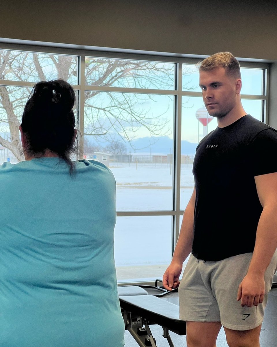 Tharin coaching a client at Buhler Wellness Center